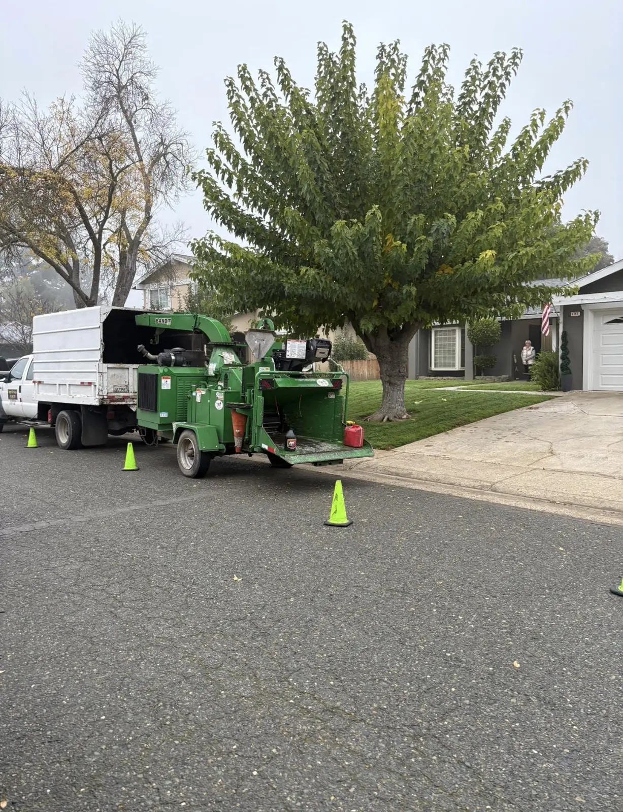 Jaeger's Tree Service chipper working at a residential property