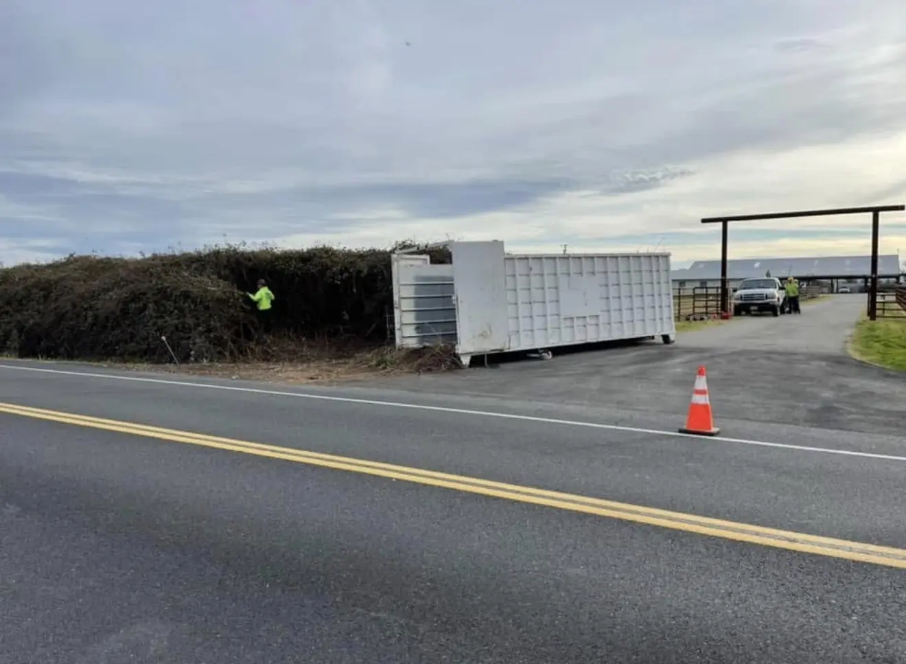 Cleared roadside vegetation and debris trailer
